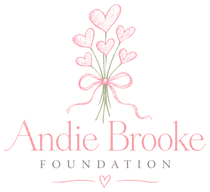 The Andie Brooke Foundation logo: a bouquet of pink hearts tied with a ribbon